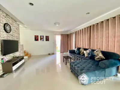 Spacious living room with modern decor and plush sectional sofa