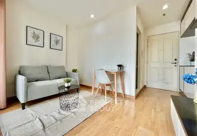 Bright and cozy living room with modern decor and wooden flooring.