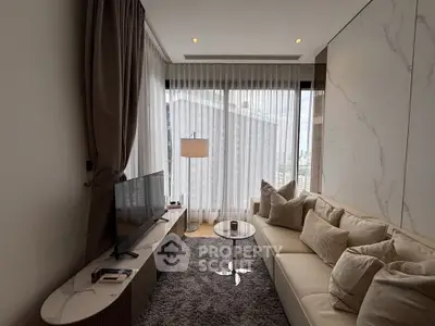 Luxurious modern living room with plush sofa, large TV, and floor-to-ceiling windows offering stunning city views.