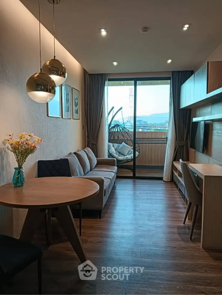 Modern living room with stylish decor and balcony view