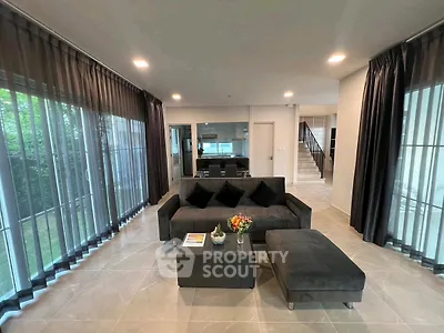 Spacious modern living room with elegant decor and large windows