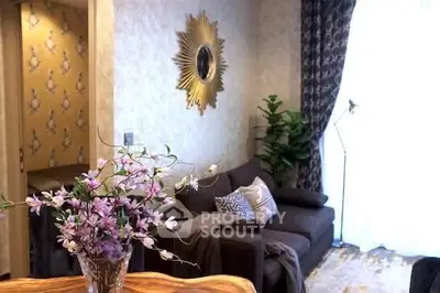 Stylish living room with elegant decor and cozy seating area.