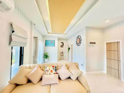 Luxurious living room with elegant decor and plush seating in modern home.