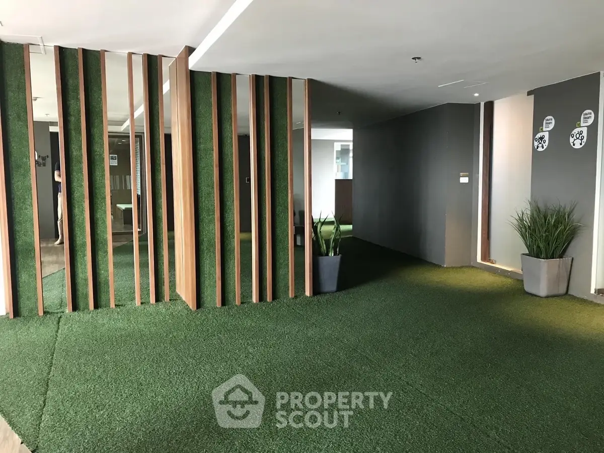 Modern building interior with green carpet and stylish decor