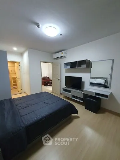 Modern bedroom with sleek furniture and ambient lighting