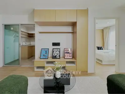 Modern living room with stylish decor and open kitchen layout in a contemporary apartment.