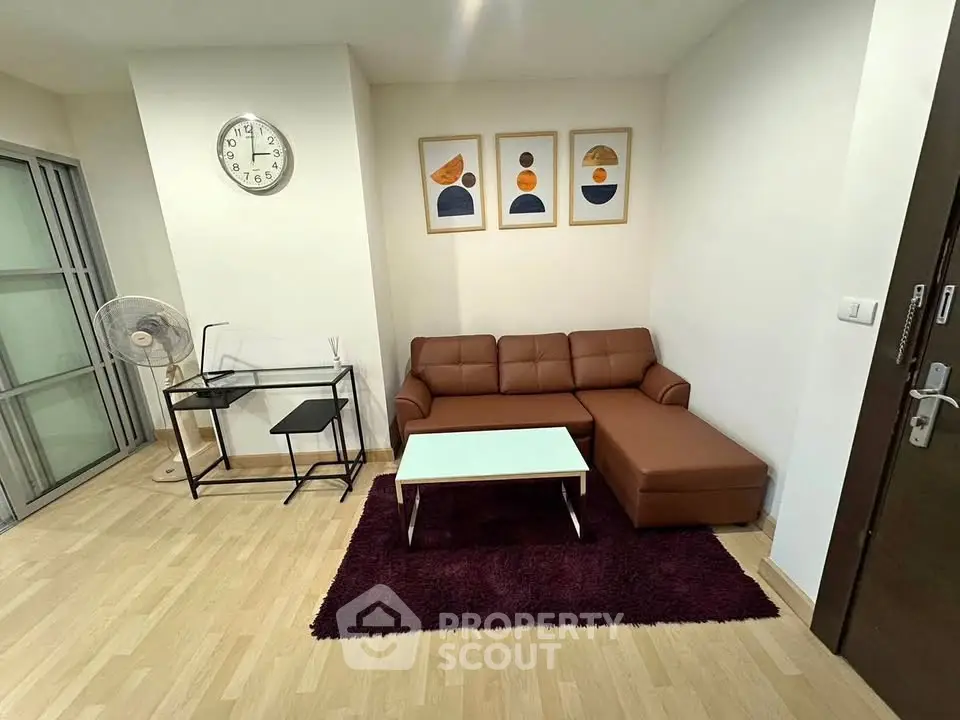 Modern living room with stylish decor and comfortable seating in a cozy apartment.