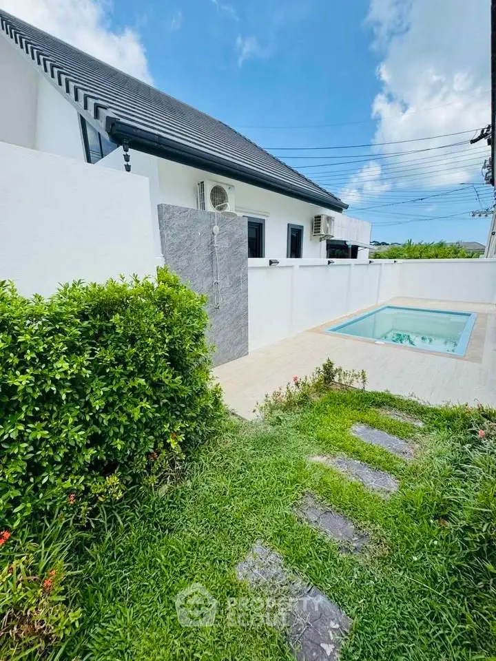 Charming modern home with private pool and lush garden, perfect for relaxation and entertaining.