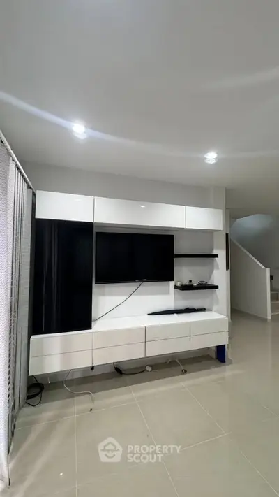 Modern living room with sleek TV unit and minimalist design