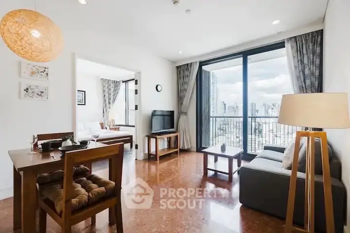 Spacious living room with city view and modern furnishings in high-rise apartment.