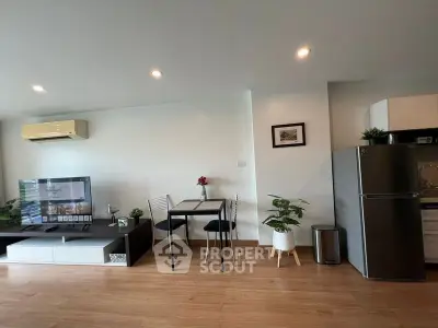 Modern living room with sleek furniture and open kitchen layout