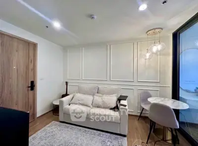 Modern living room with cozy sofa and elegant lighting in a stylish apartment.