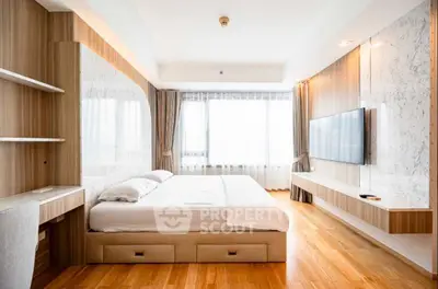Luxurious modern bedroom with wooden flooring and large windows