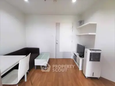 Modern living room with sleek furniture and wooden flooring