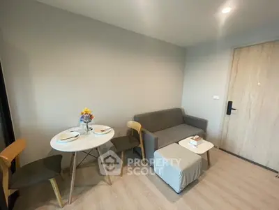 Cozy living room with modern furniture and dining area in a stylish apartment