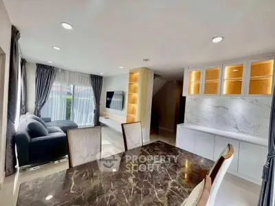 Modern living room with elegant marble table and cozy seating area