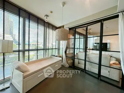 Modern living room with floor-to-ceiling windows and stylish decor