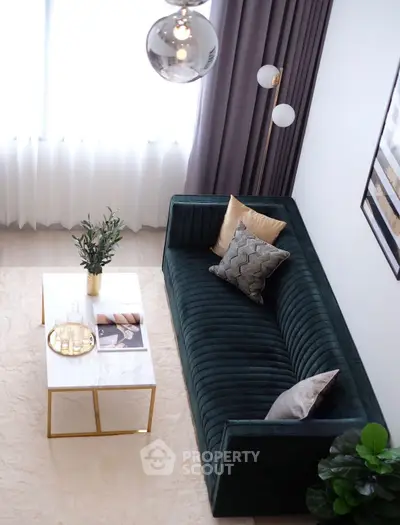 Elegant living room with plush green sofa and chic decor