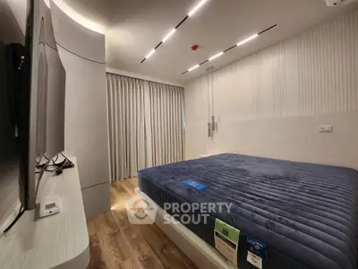 Modern bedroom with sleek design and ambient lighting