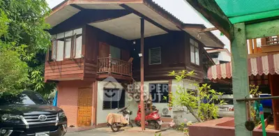 Charming traditional wooden house with lush garden and parking space, perfect for serene living.