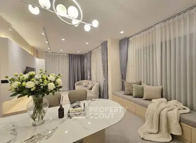 Luxurious modern living room with elegant decor and cozy seating area.