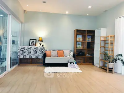 Spacious living room with modern decor and wooden flooring