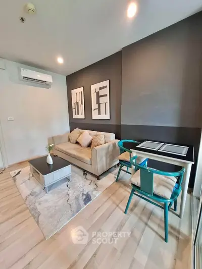 Modern living room with stylish decor and cozy seating area, perfect for relaxation and entertaining.