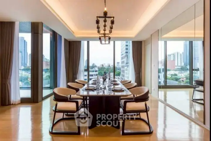 Luxurious dining room with city view, elegant chandelier, and floor-to-ceiling windows.