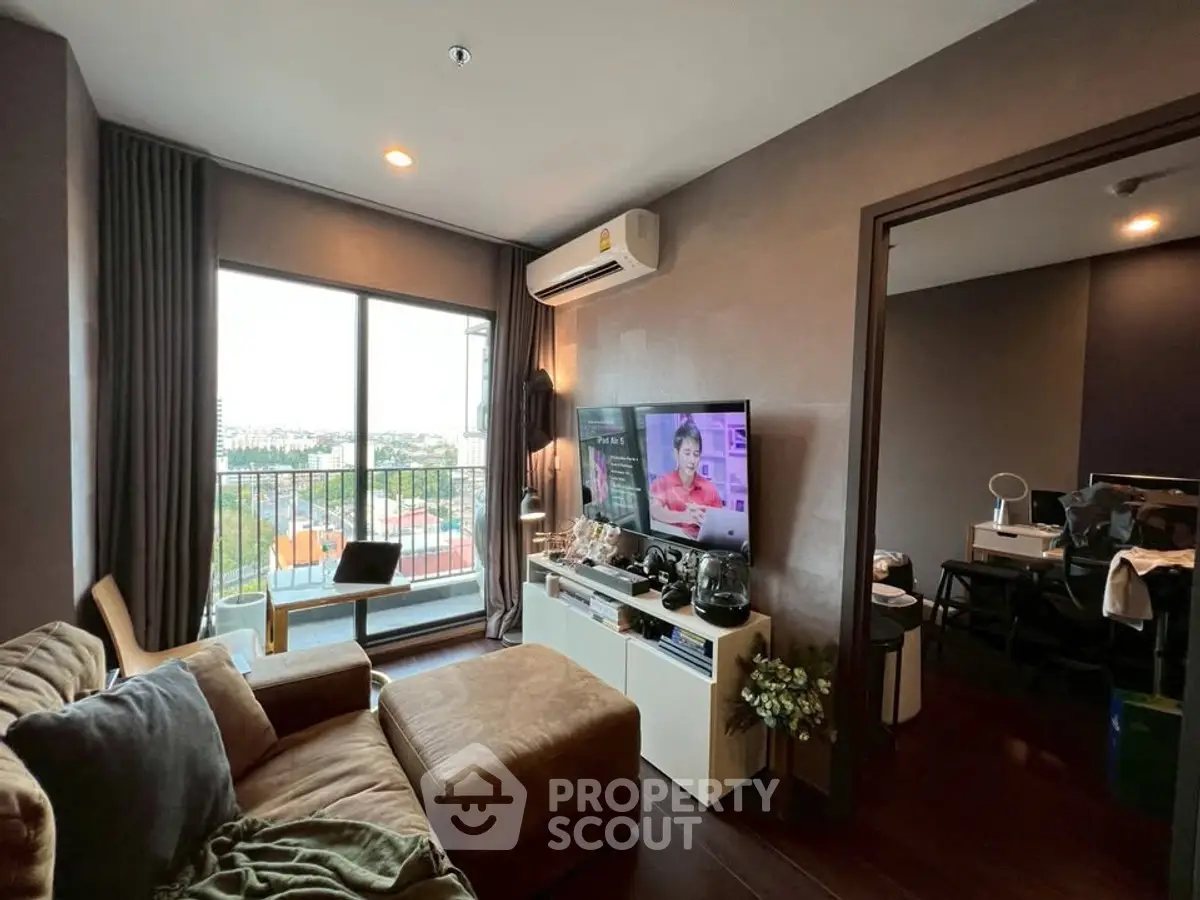 Modern living room with balcony view and cozy seating area