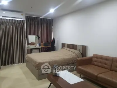 Modern bedroom with cozy brown sofa and stylish decor
