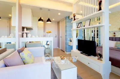 Modern open-layout living room with stylish decor and cozy ambiance