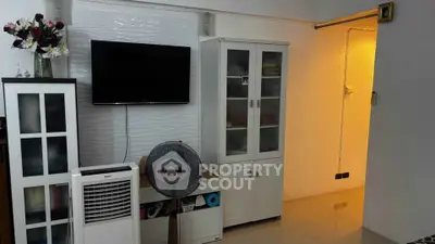 Cozy living room with modern decor and wall-mounted TV