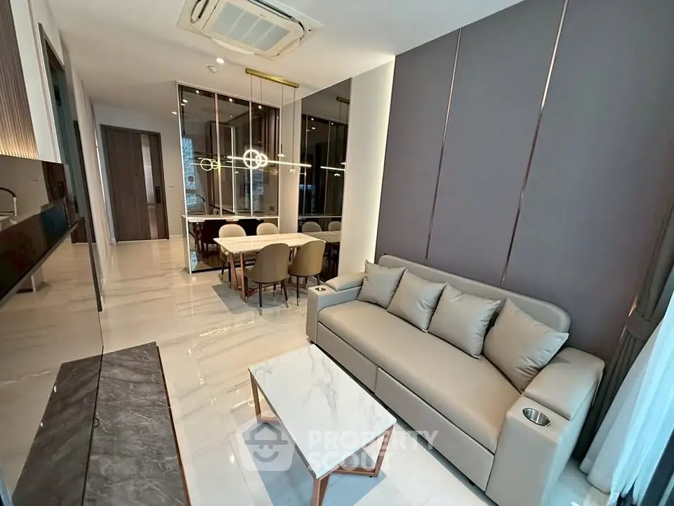 Luxurious modern living room with elegant dining area and sleek kitchen design