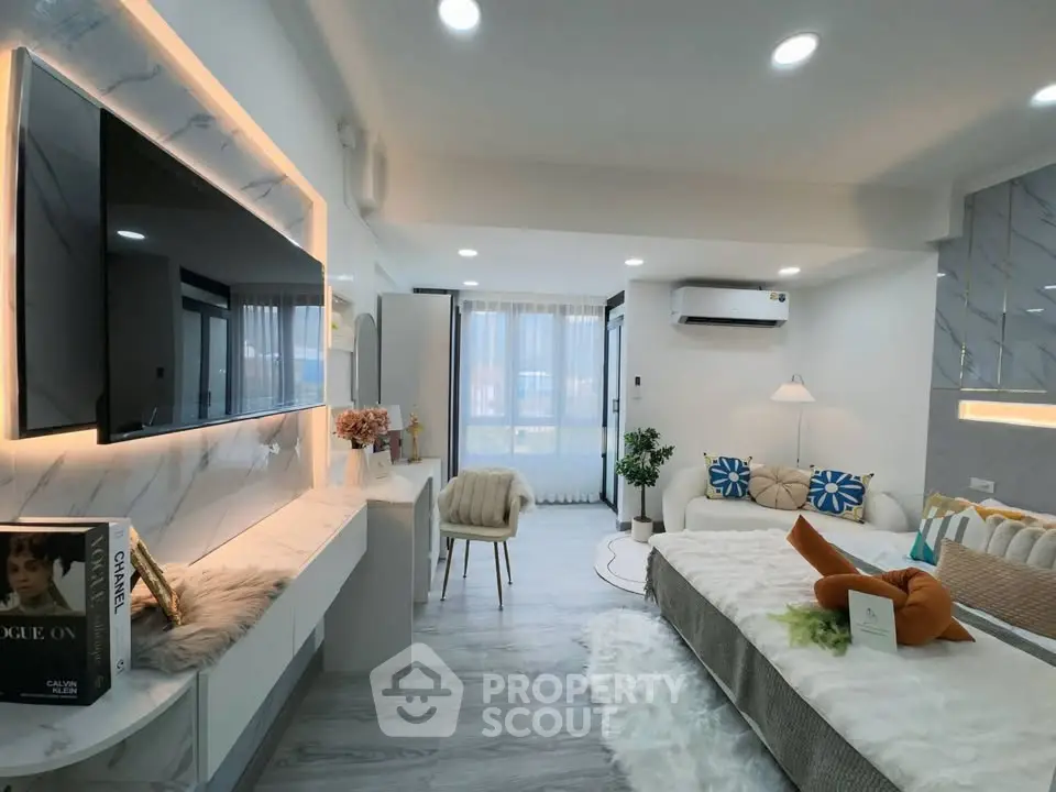 Luxurious modern living room with stylish decor and large TV