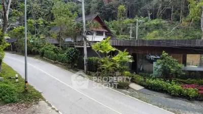 Charming countryside property with lush greenery and rustic architecture, perfect for nature lovers seeking tranquility.