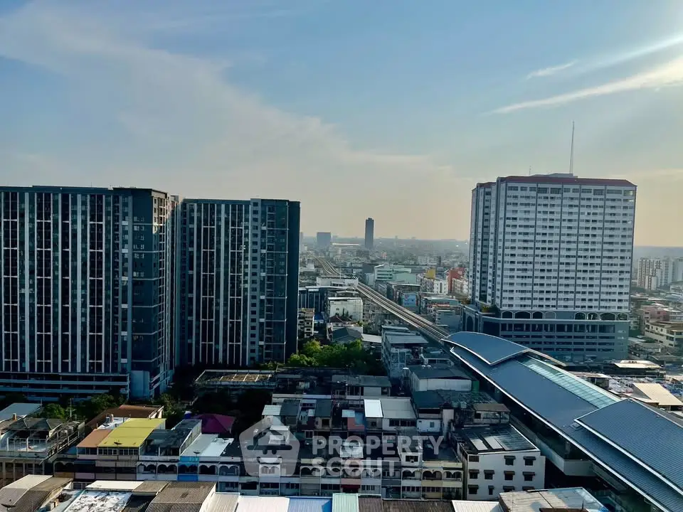 Stunning cityscape view from high-rise building showcasing urban skyline and modern architecture.