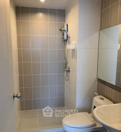 Modern bathroom with sleek shower and elegant tile design