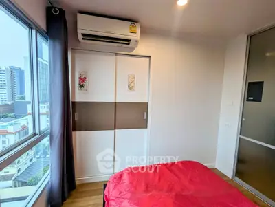 Cozy bedroom with city view and modern air conditioning