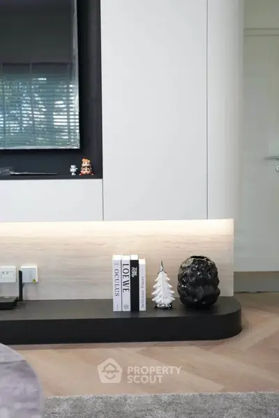 Modern living room with sleek decor and stylish shelving