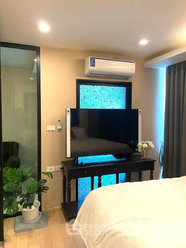 Modern bedroom with air conditioning and stylish decor