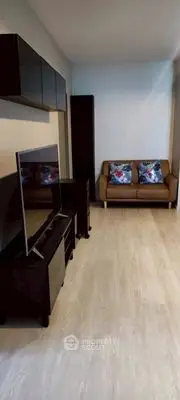 Modern living room with sleek furniture and wooden flooring