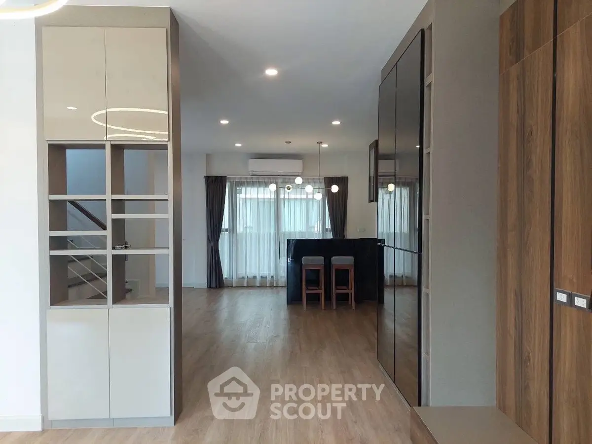 Spacious modern living area with open layout and stylish wooden flooring