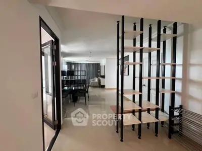 Spacious modern living room with open layout and stylish shelving unit