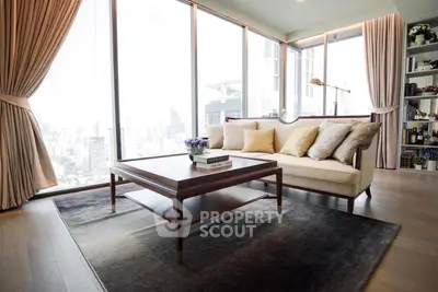Luxurious living room with panoramic city views and elegant decor.