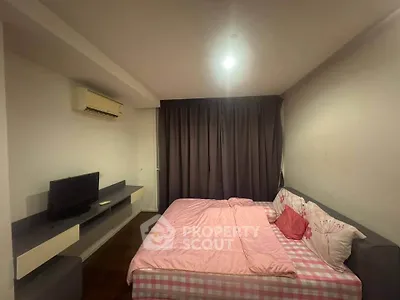 Cozy bedroom with modern furnishings and soft lighting, perfect for relaxation and comfort.