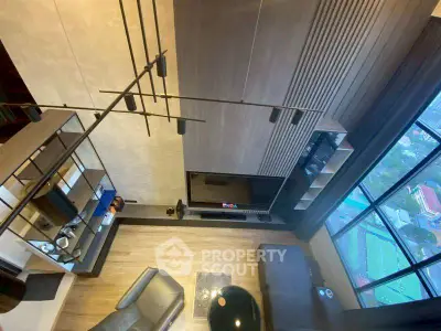 Modern living room with high ceiling and large window view