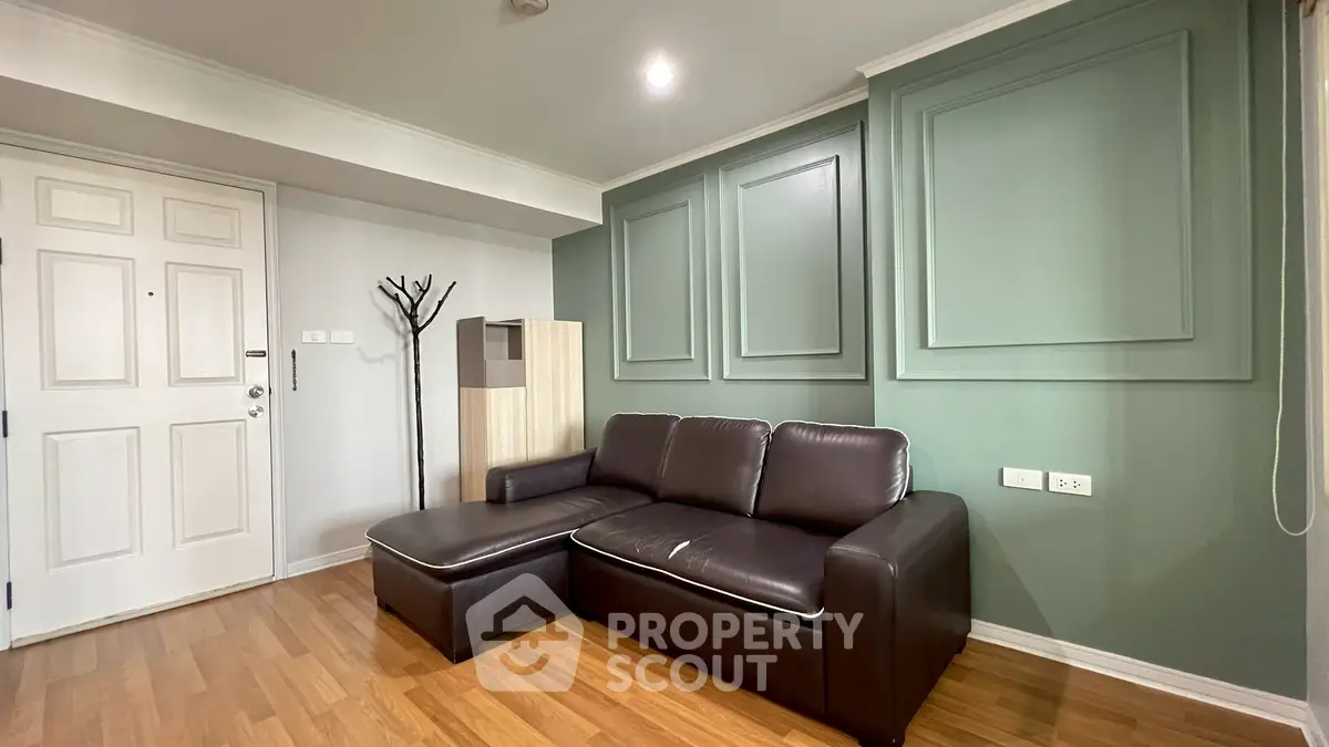 Modern living room with stylish leather sofa and elegant wall paneling