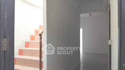Minimalist interior with staircase and hallway in modern property