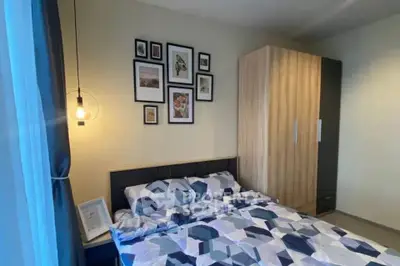 Cozy bedroom with modern decor and ample storage space