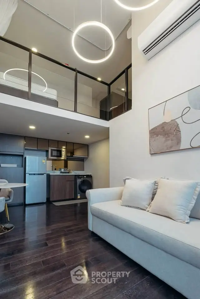 Modern loft apartment with high ceilings and stylish lighting